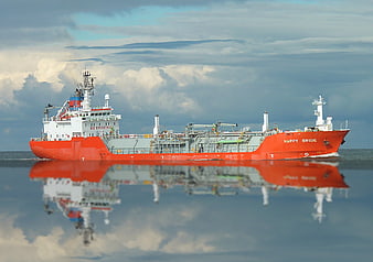 Red Cargo Ship Named Happy Bride On Calm Sea