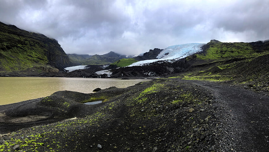 Icelandic Glacier Lagoon with Black Sand and Green Moss
