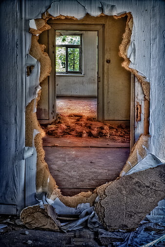 Broken Hole in Dilapidated Wall of Abandoned House Interior