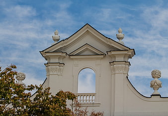 White Baroque Church Tower Against Blue Sky