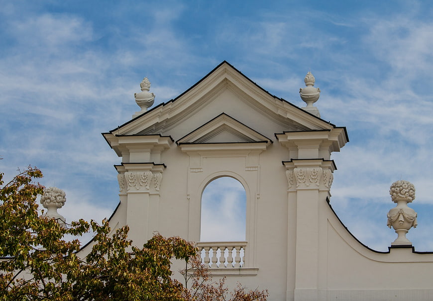 White Baroque Church Tower Against Blue Sky