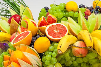Colorful Fresh Fruit Arrangement With Citrus, Grapes, And Melon