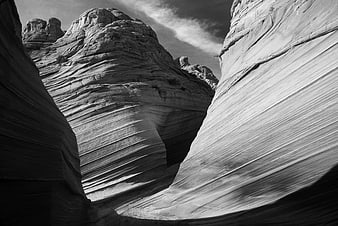 Black and white sandstone rock formations in a canyon