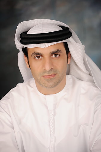 Portrait of Middle Eastern Man in Traditional White Thobe and Ghutra