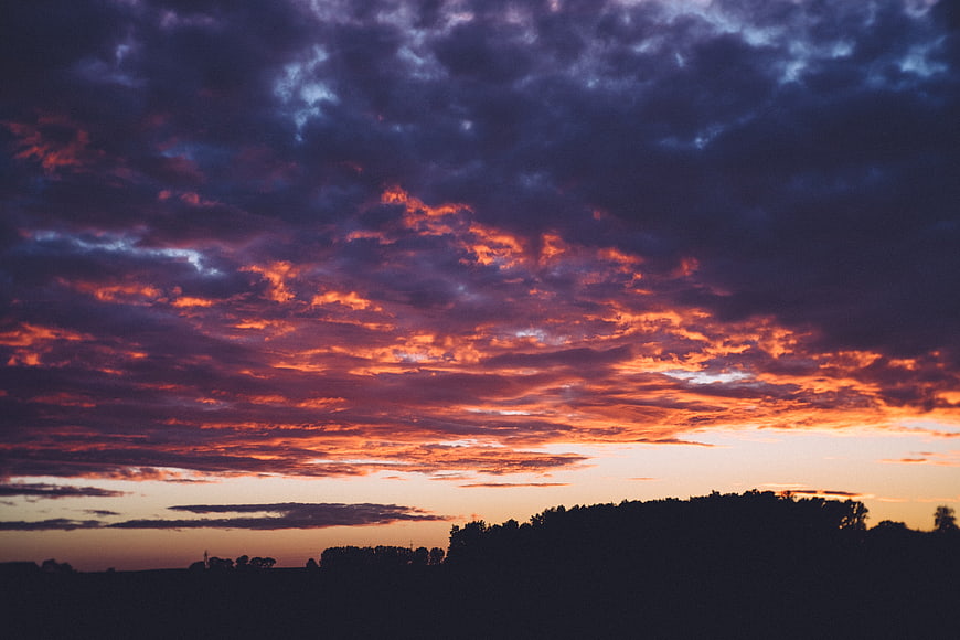 Dramatic Sunset Sky with Fiery Orange and Purple Clouds