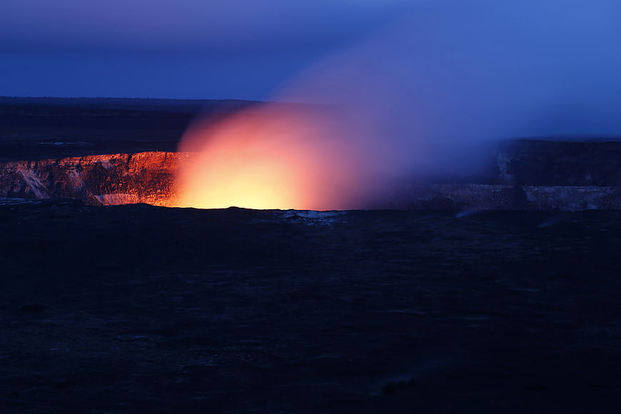 Volcanic Eruption at Night with Glowing Lava and Smoke