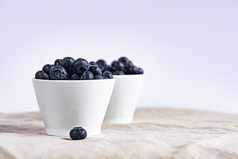 Fresh Blueberries in White Bowls on Linen