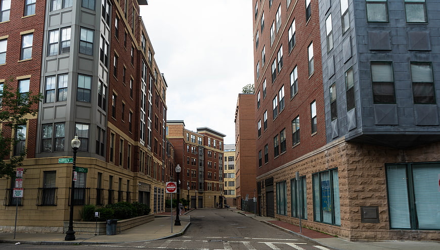 Urban street view between modern brick apartment buildings