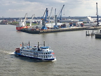 Blue and white paddle steamer sailing in Hamburg port