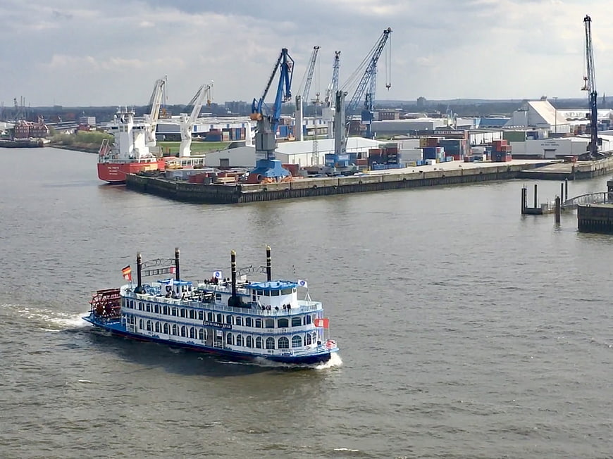Blue and white paddle steamer sailing in Hamburg port