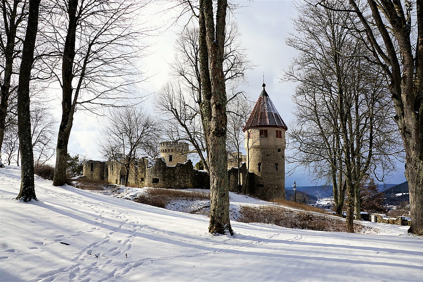 Snowy Castle Ruins in Winter Forest Landscape
