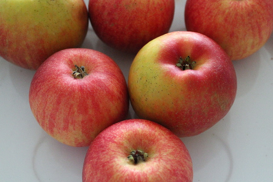 Fresh Red and Yellow Apples on White Background