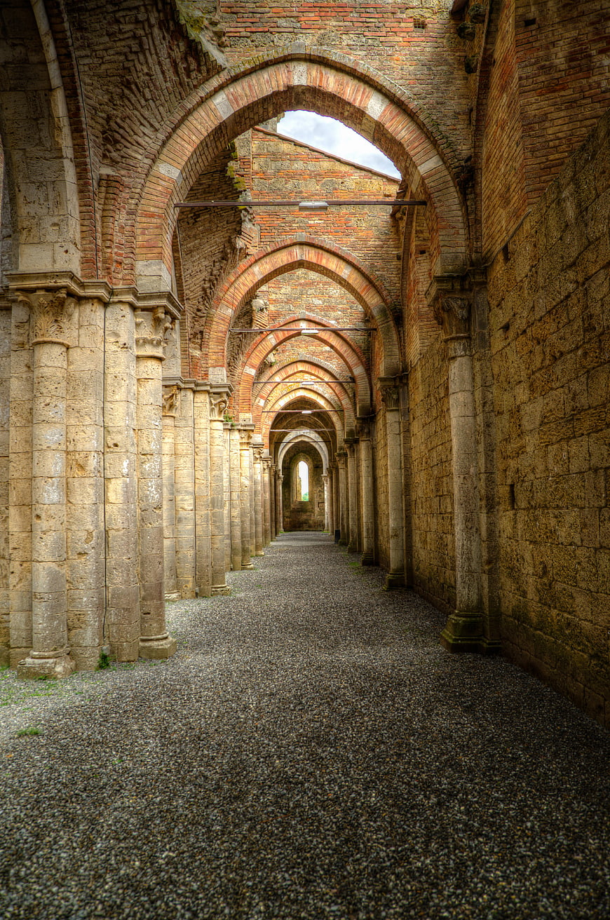 Ancient Gothic Archway Corridor in Italian Abbey Ruins