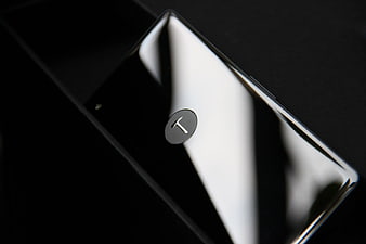 Close-up of sleek black smartphone with T logo