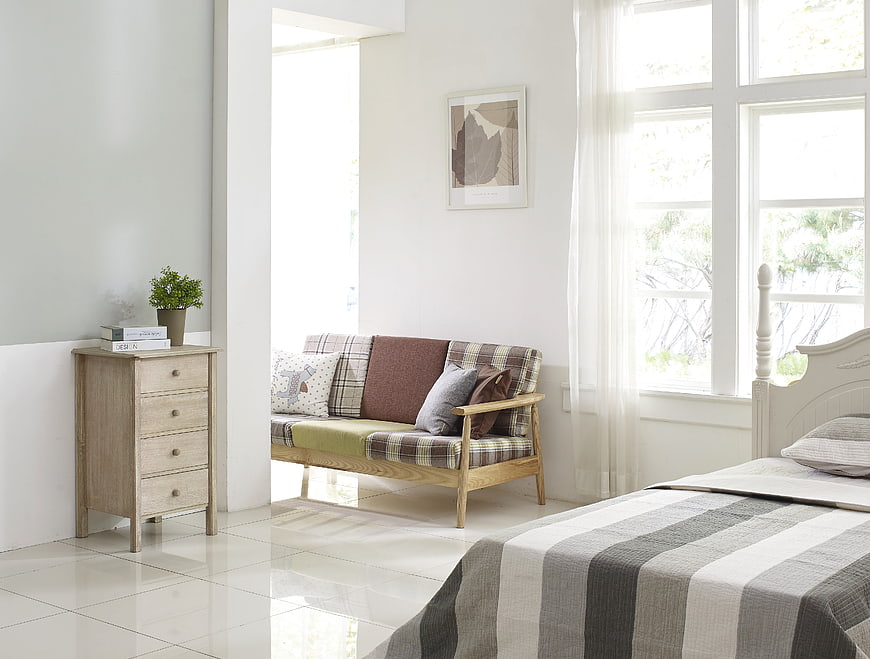 Bright Modern Bedroom with Plaid Sofa and Wooden Furniture