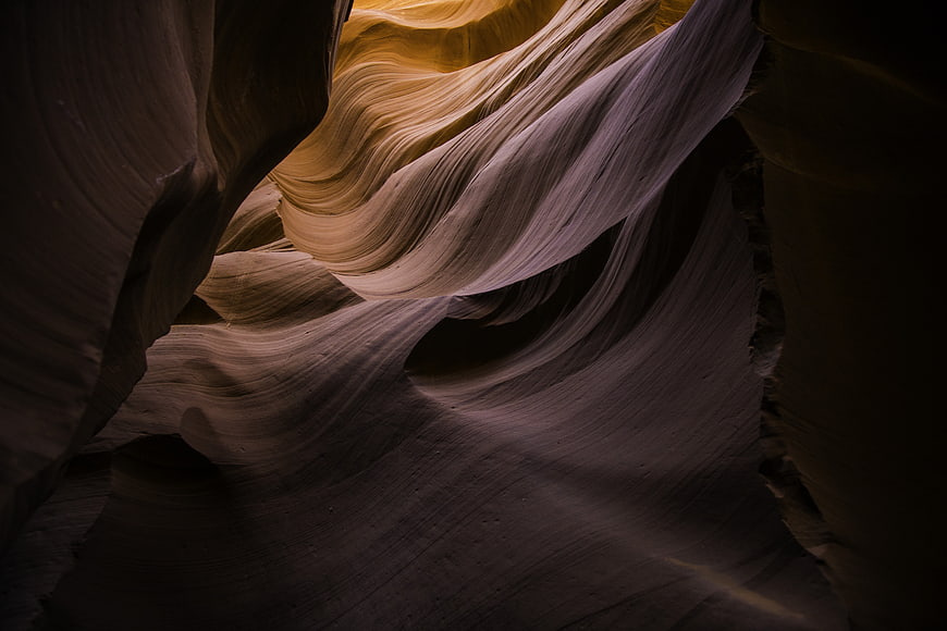 Abstract sandstone waves in slot canyon with dramatic lighting