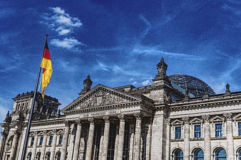 Reichstag Building Berlin with German Flag and Glass Dome