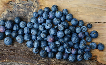 Fresh Blueberries on Rustic Wooden Surface
