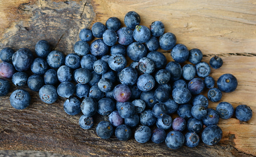 Fresh Blueberries on Rustic Wooden Surface
