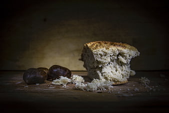 Rustic Artisan Bread with Chestnuts on Wooden Table