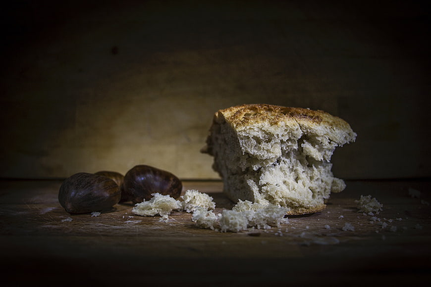 Rustic Artisan Bread with Chestnuts on Wooden Table