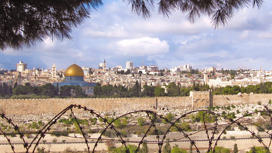 Jerusalem skyline with Dome of the Rock and barbed wire foreground