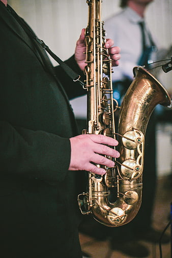 Close-up of musician playing golden saxophone