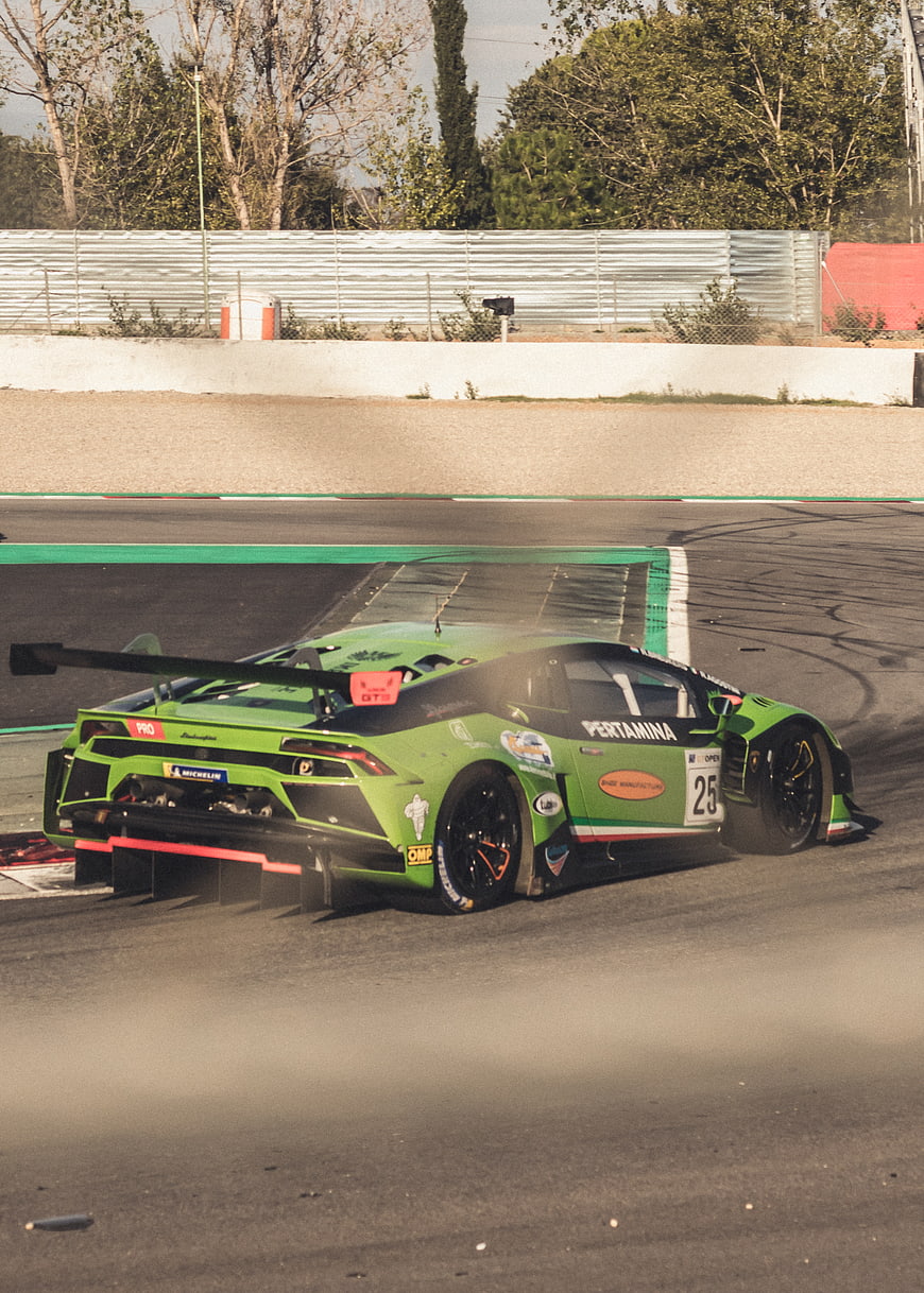 Green Lamborghini Super Trofeo Race Car on Track