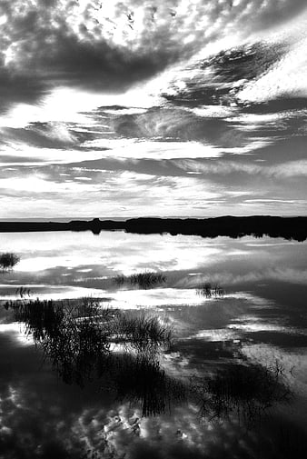 Dramatic Black and White Lake Reflection with Clouds
