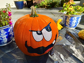 Painted Halloween Pumpkin with Angry Face on Patio