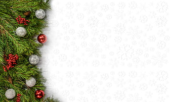Christmas Pine Branches and Ornaments on White Snowflake Background