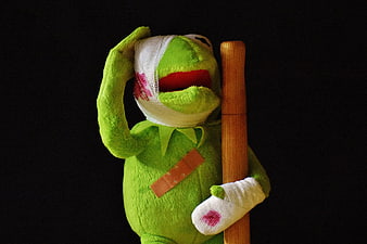 Injured Kermit the Frog Puppet with Bandages and Crutch