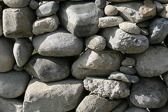 Stacked gray stones wall texture background