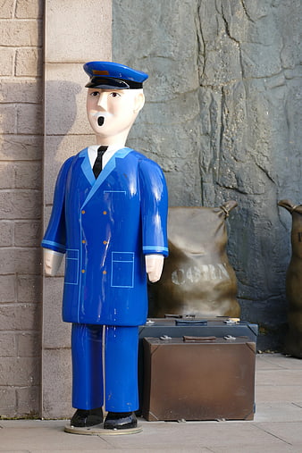 Blue Railway Conductor Statue with Luggage