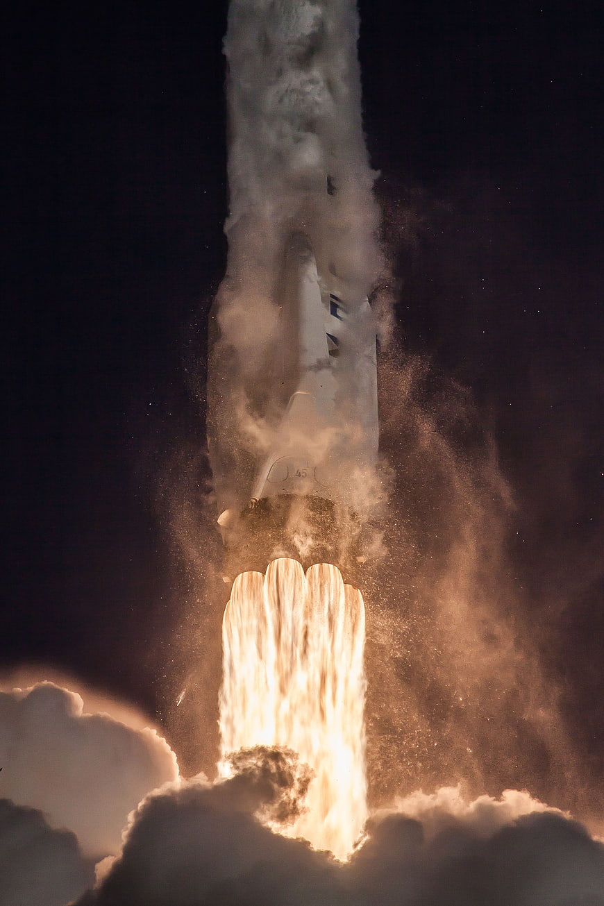 Space Shuttle Launching Into Night Sky With Fire And Smoke