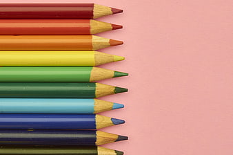 Colorful Pencils Arranged on Pink Background