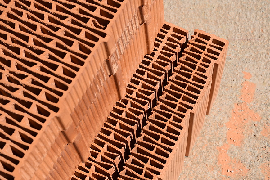 Stacked Hollow Clay Bricks With Geometric Patterns