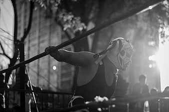 Luchador Wrestler in Mask Holding Ring Rope Outdoors