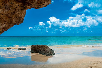 Tropical Beach Landscape With Rock Overhang And Turquoise Sea