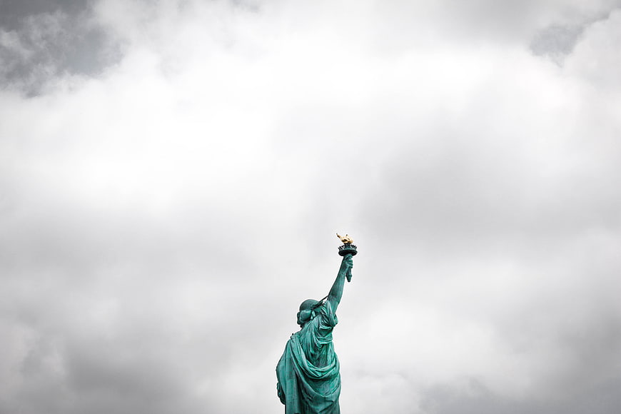 Statue of Liberty Torch Against Cloudy Sky
