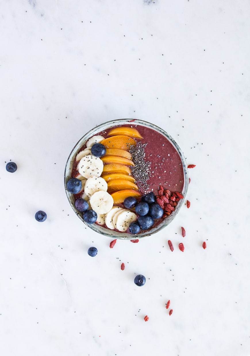 Top View Vegan Smoothie Bowl with Fresh Fruit Toppings