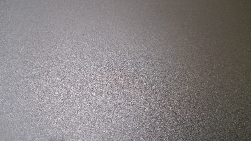 Close-up of textured gray metal surface background