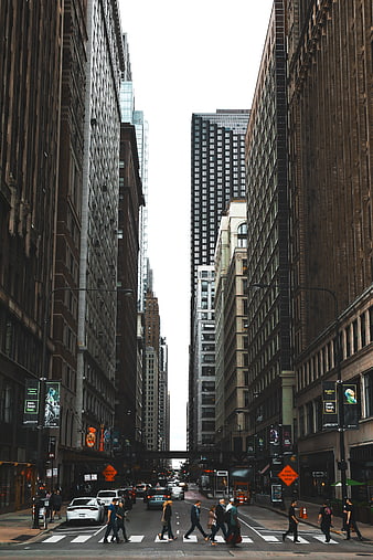 Urban City Street Canyon with Pedestrians and Tall Buildings