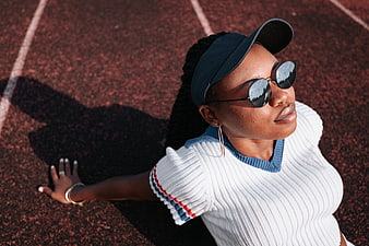 Stylish Black Woman in Sunglasses on Running Track