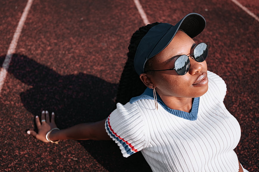 Stylish Black Woman in Sunglasses on Running Track