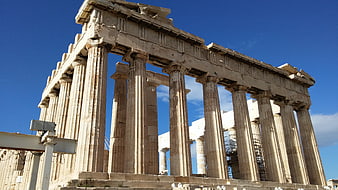Ancient Parthenon Temple Columns Against Blue Sky In Athens Greece