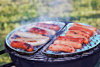 Assorted Grilled Sausages On Outdoor Barbecue Grill