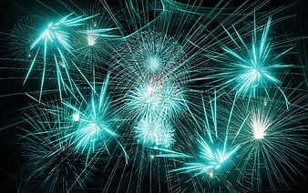 Vibrant Cyan Fireworks Exploding in Night Sky