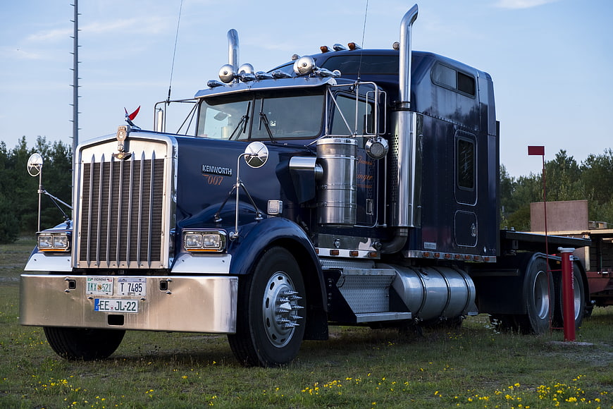 Classic Blue Kenworth W900 Semi Truck in Field
