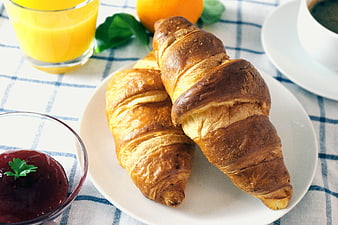 Fresh Croissants with Orange Juice and Jam Breakfast